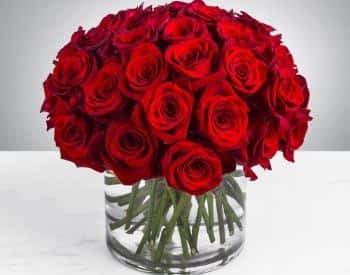 Large bouquet of red roses in glase vase