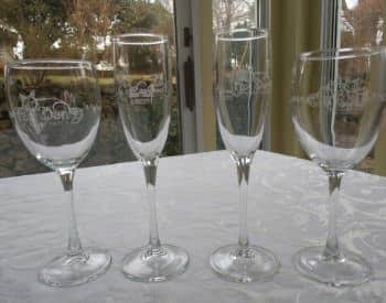 Four wine glasses with Briar Patch logo etched on them