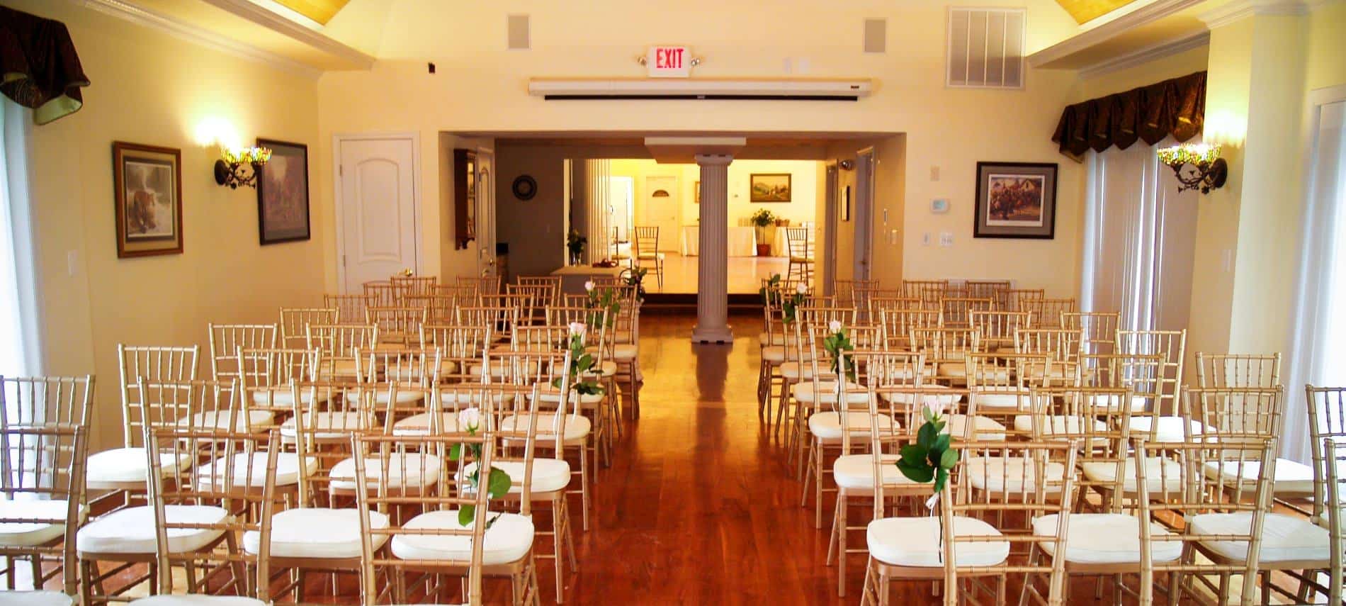 Large room set up with chairs for a wedding ceremony