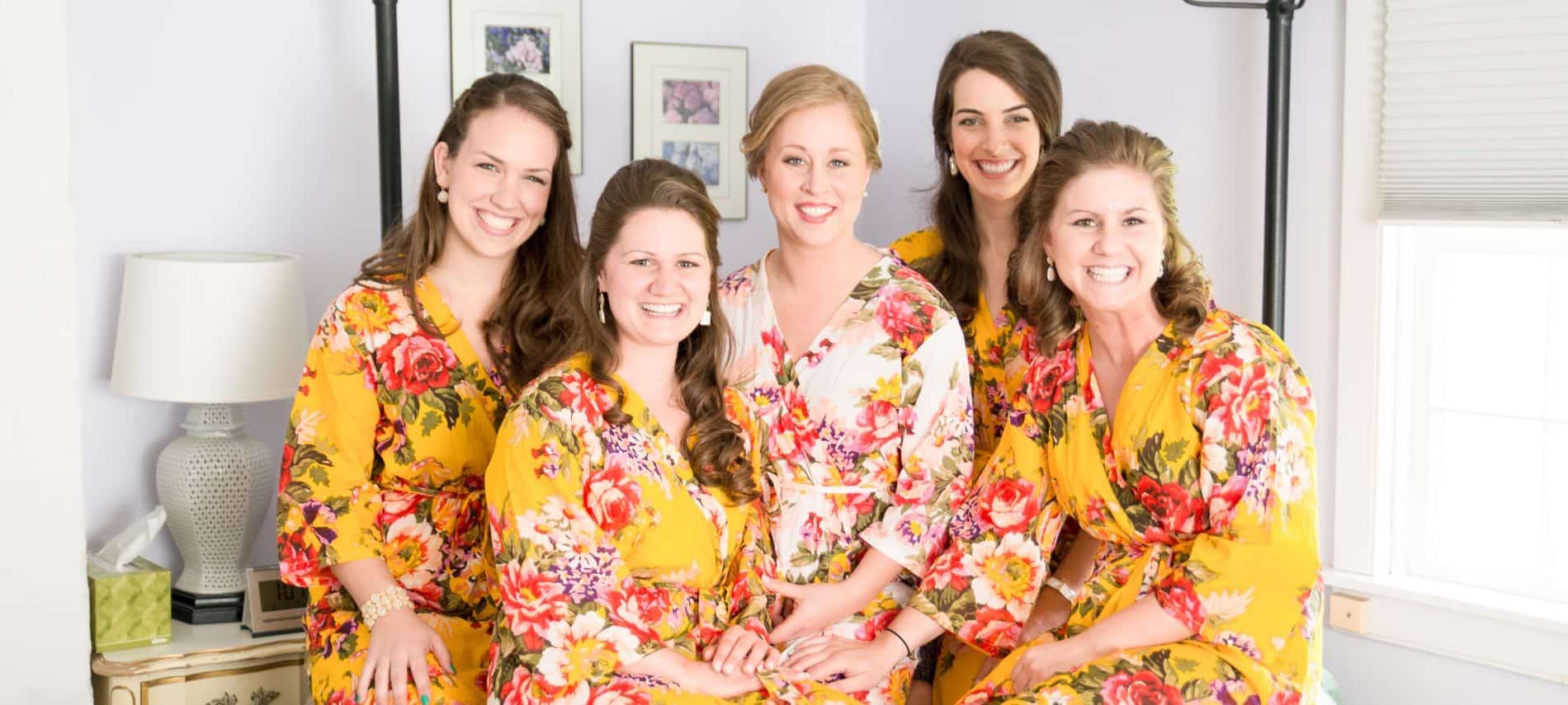 Bride and bridesmaids wearing floral silk robes