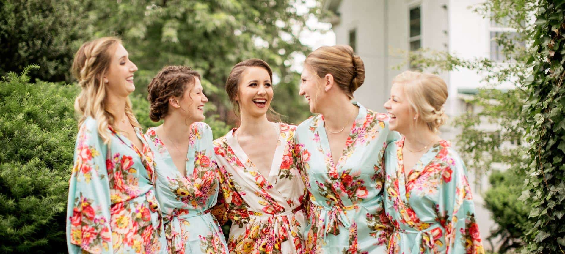 Bride and bridesmaids wearing floral silk robes